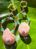 Shark eye earrings with gold, brown and green beads wi th gold cuff hooks.