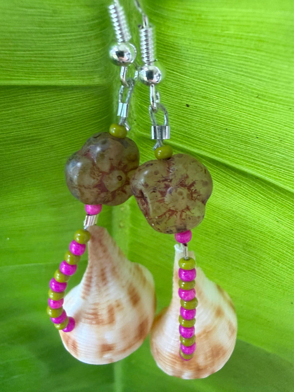 Pear whelk earrings with stone flower bead.