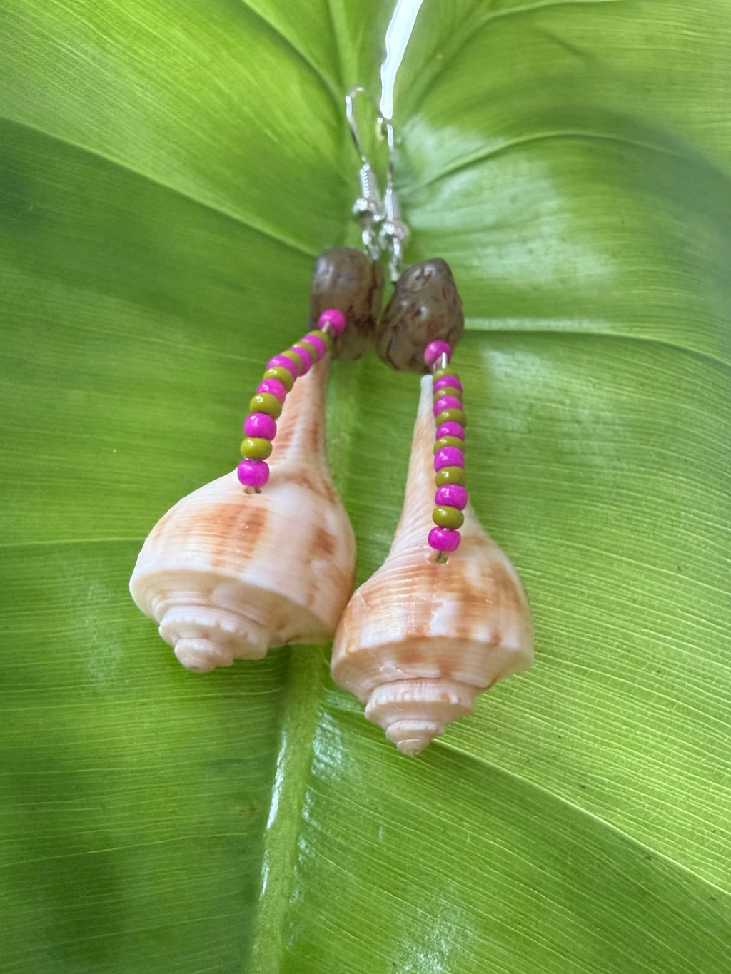 Pear whelk earrings with stone flower bead.