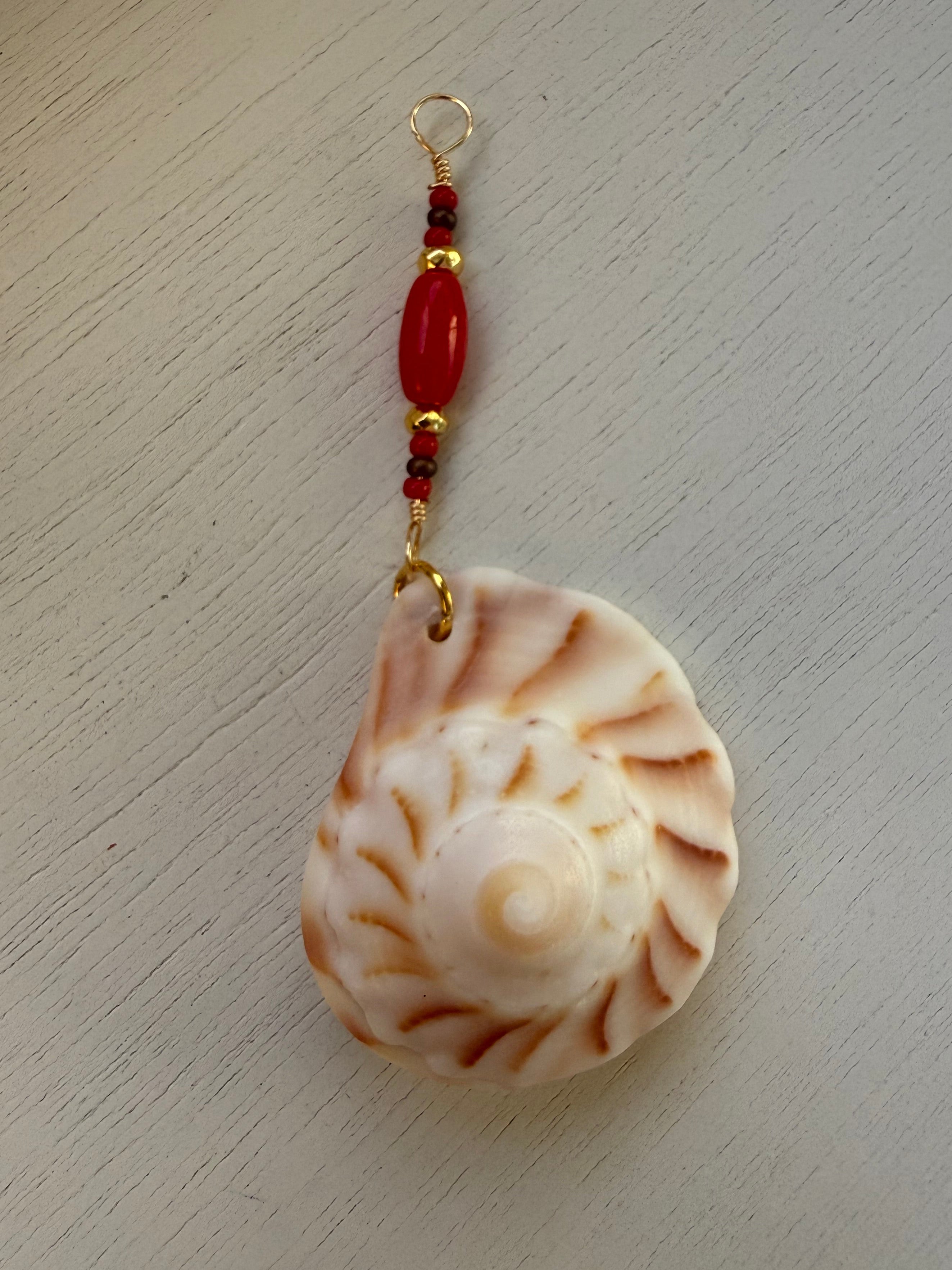 Lightning Whelk dangle earrings and drop pendant.