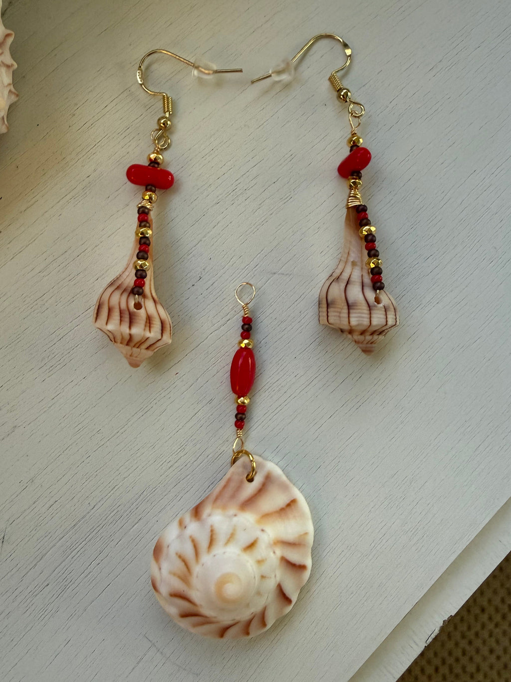 Lightning Whelk dangle earrings and drop pendant.