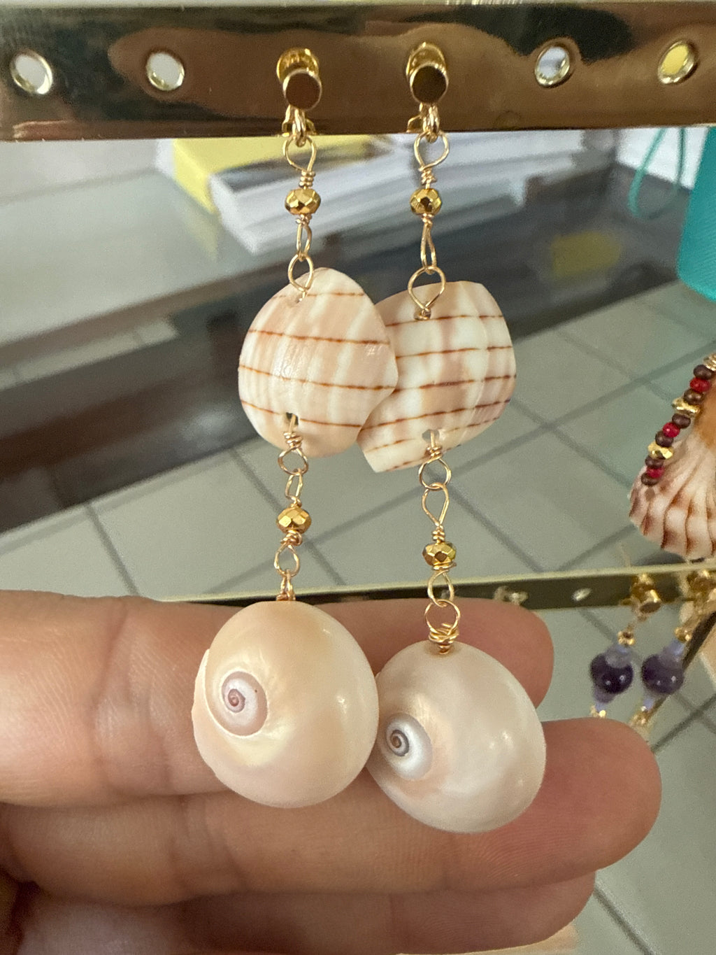 Gold dangle earrings w/Shark eyes and pieces of banded tulips.