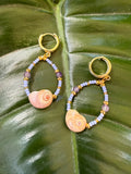 Mini shark eye shell earrings with amethyst, purple and gold beads. Gold cuff closure.