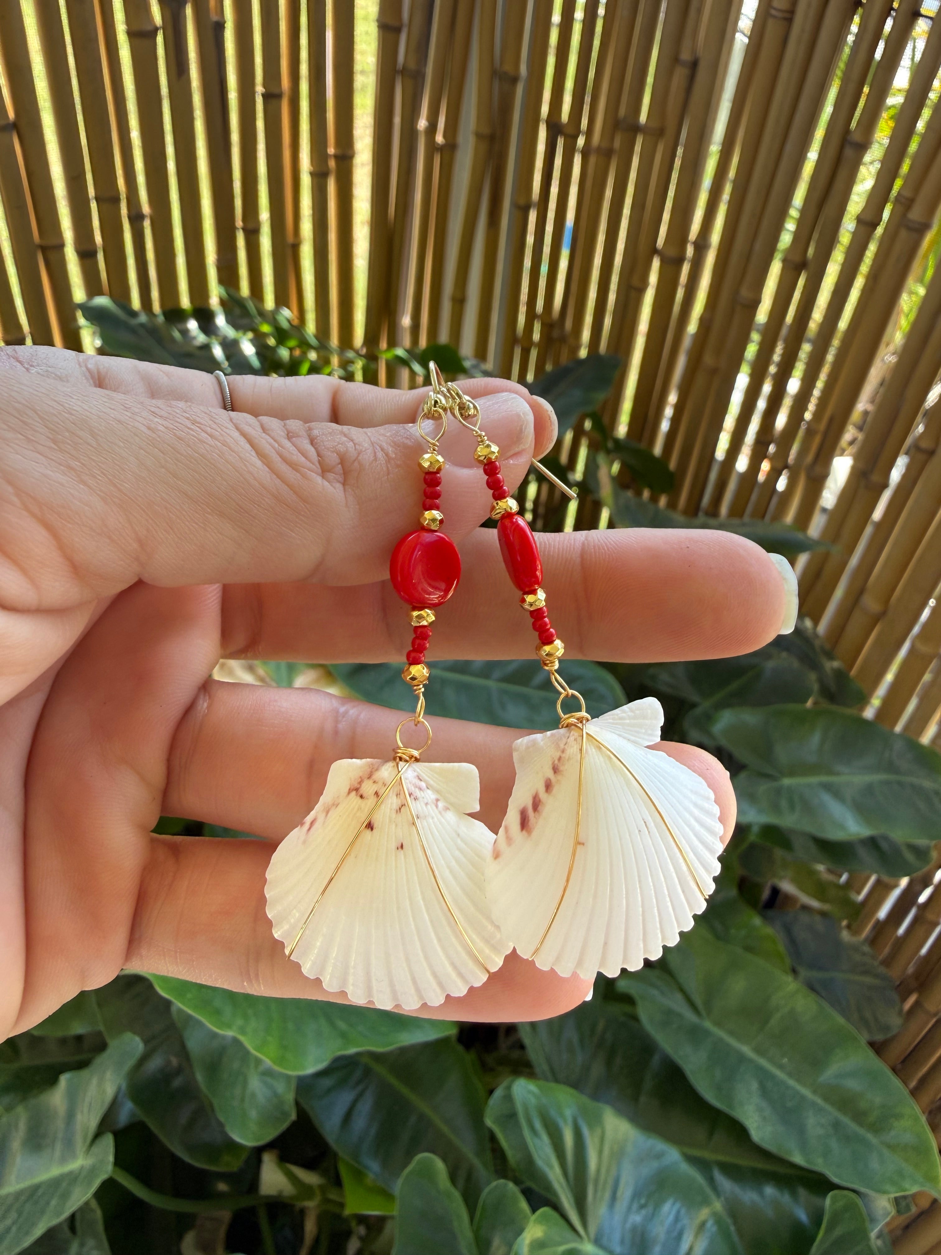 White scallop earrings with gold wire wrap, red and gold beads.