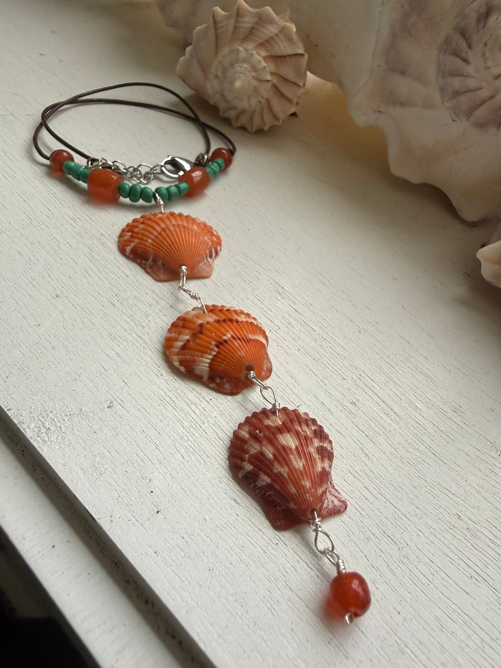 Orange Scallop necklace.