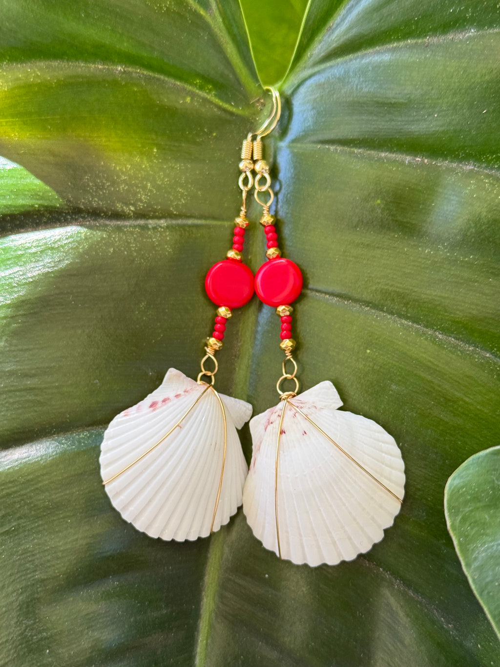 White Scallop w/ Gold wire wrap.